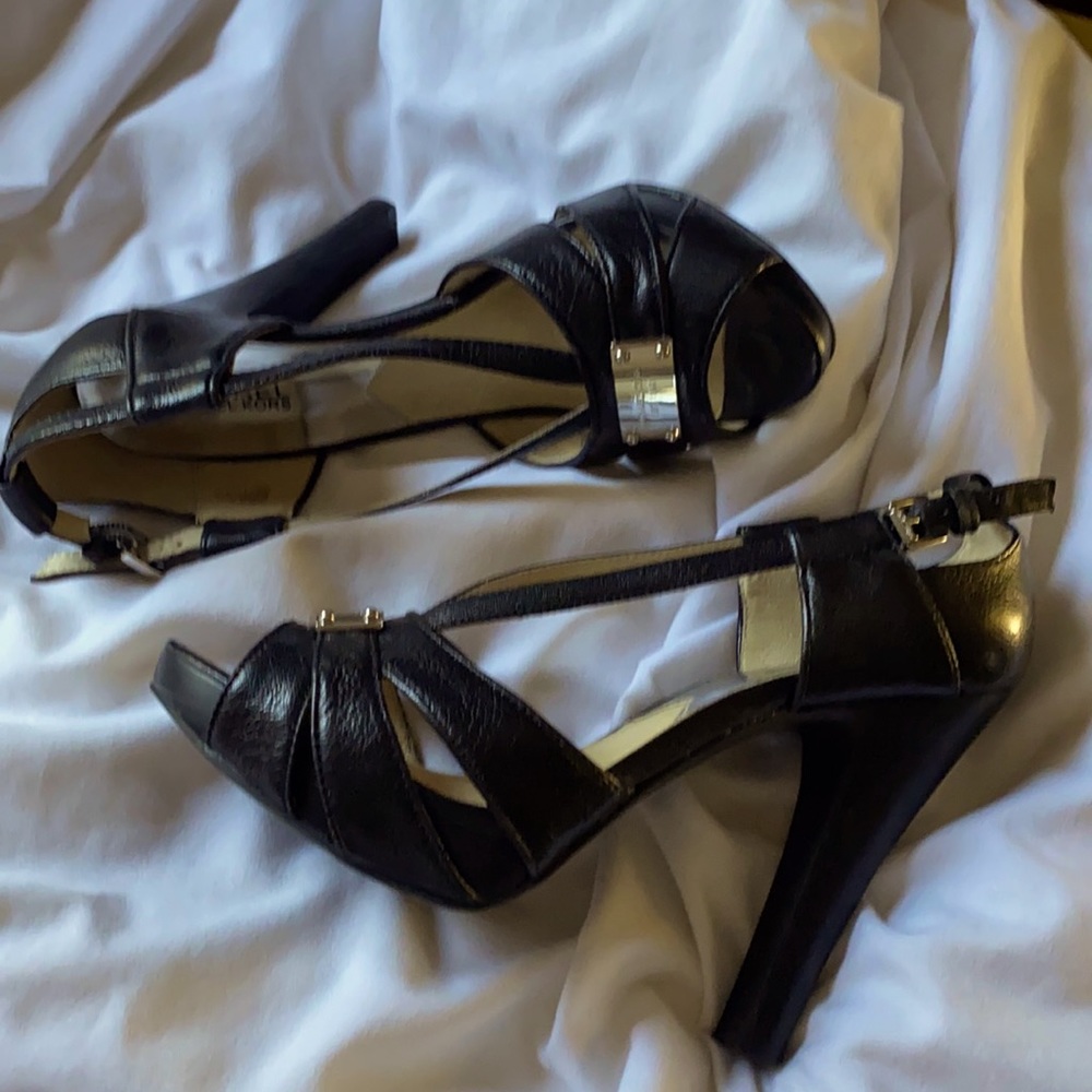 Michael Kors black leather pumps with silver accents. Great condition.